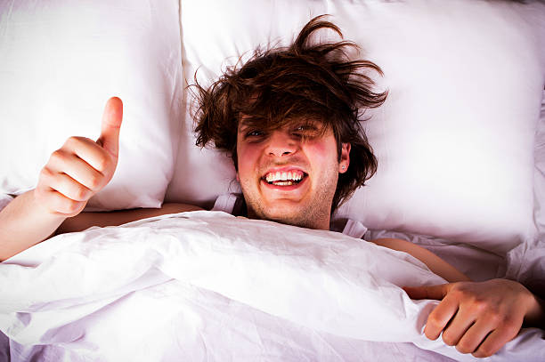 Messy Boy Showing Thumbs Up Stock Photo - Download Image Now - Bed -  Furniture, Tangled Hair, Bizarre - iStock