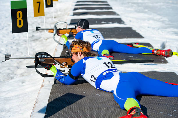 istock Two young man shooting at biathlon competition 185090119