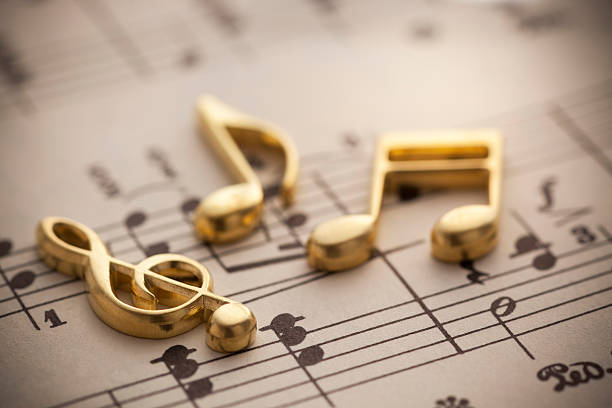 Music Musical notes on an old music score. musical note photos stock pictures, royalty-free photos & images