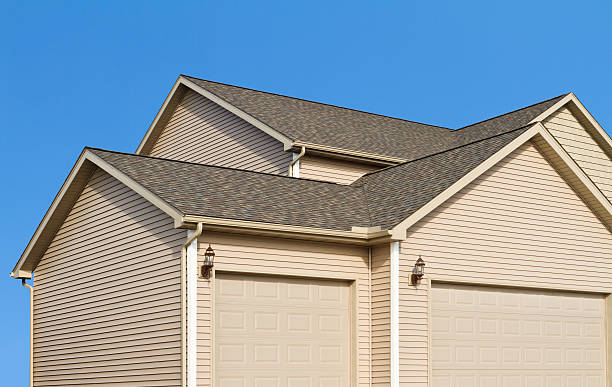 istock New home construction,showing siding,roof, garage and gutters 185090529