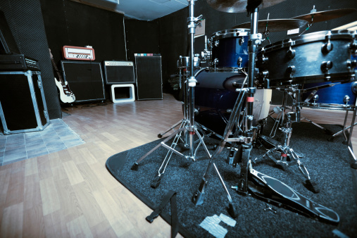 Recording studio with drum kit and amplifiers