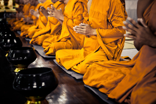 Buddhist monks praying