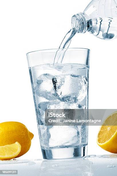 Pouring A Glass Of Water Stock Photo - Download Image Now - Artificial Ice, Bottle, Cold Drink