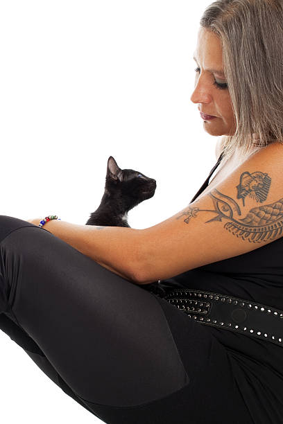 istock Woman and kitten looking into each others eyes 185091421