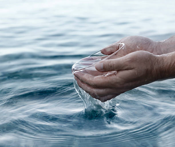 Hands and water Hands and clean water. baptism stock pictures, royalty-free photos & images