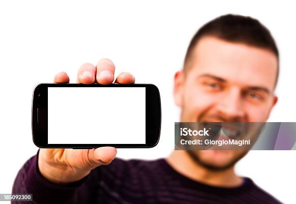 Smiling Man With Blank Screen Smartphone White Background Stock Photo - Download Image Now