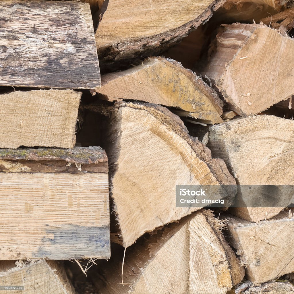 Firewood Chopped and Stacked Background Stacked firewood. Backgrounds Stock Photo