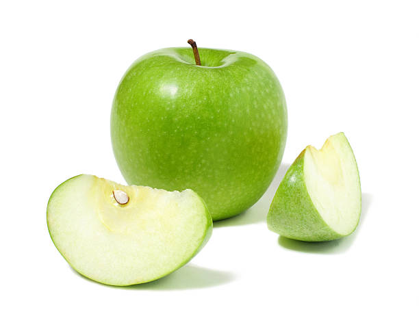 Granny Smith Apple and two apple wedges on white background stock photo