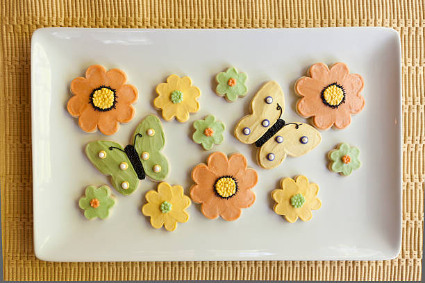 Cookies for spring on a white plate stock photo