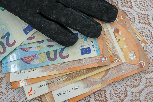 Euro Elegance: Gloved Hand Handling Banknotes
