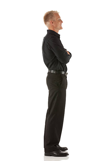 istock Happy businessman standing with his arms crossed 185093767