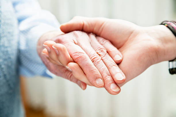 istock old and young hands togetherness care 185093831