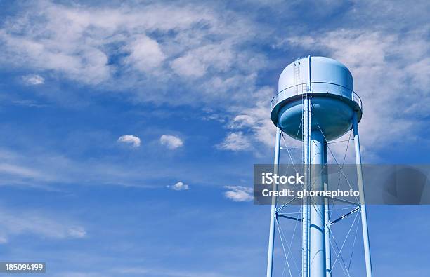 Water Tower With Wispy Clouds In Sky Behind Stock Photo - Download Image Now - Water Tower - Storage Tank, Storage Tank, Blue