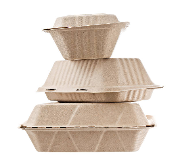 Recycled Containers To Go A close up shot of a stack of three boxes to go. They are made out of recycled materials. Isolated on white. carry out box stock pictures, royalty-free photos & images
