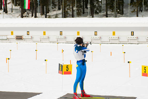 istock Female biathlon competitor at target shooting 185094724