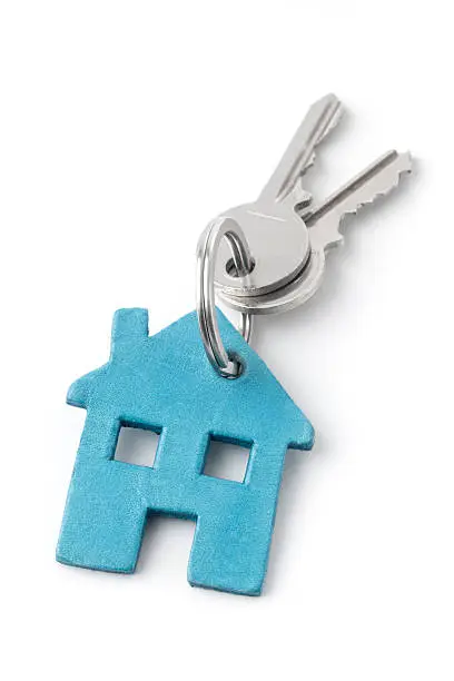 Keyring with a house and keys. House keys concept. Isolated on white.