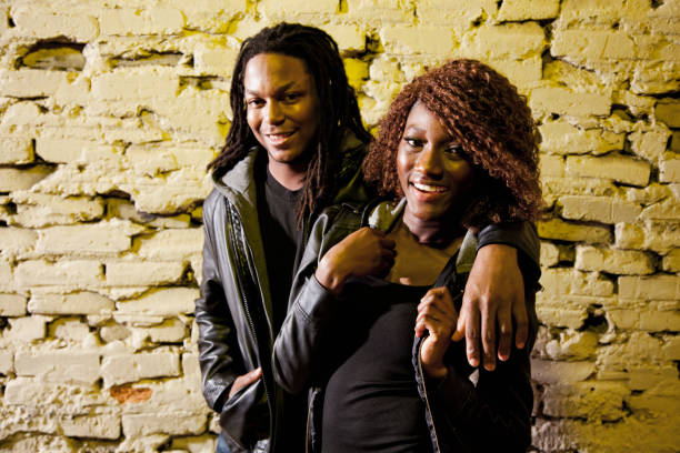 istock Young black couple in front of old brick wall 185095238