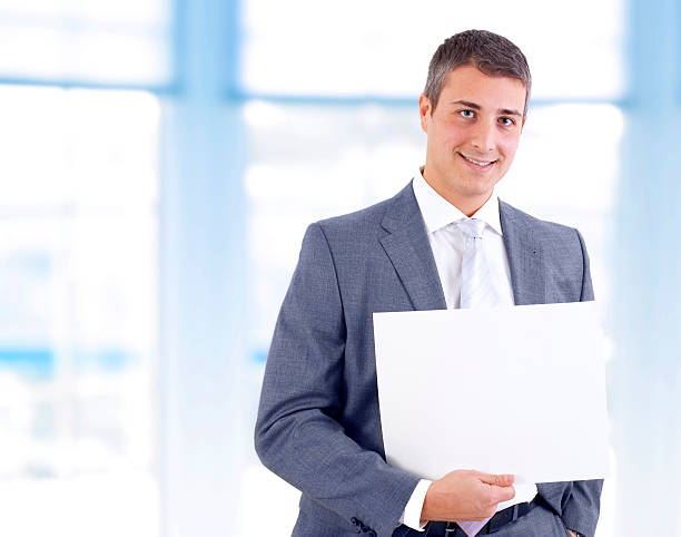 istock Young businessman with a blank sign 185095775