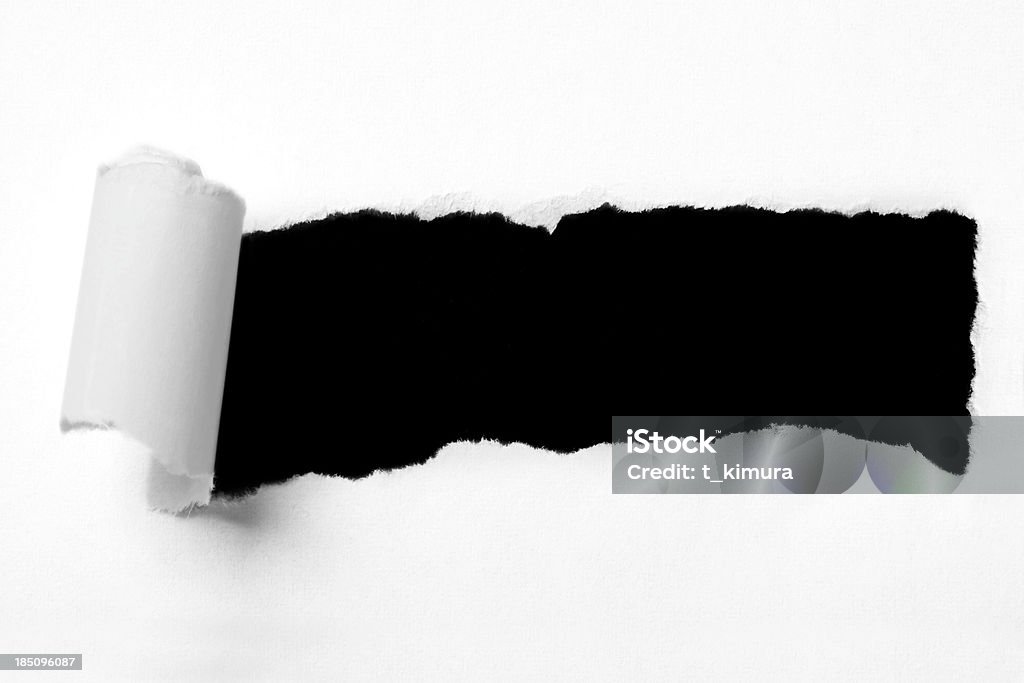 Torn paper hole torn white paper on white background. Paper Stock Photo