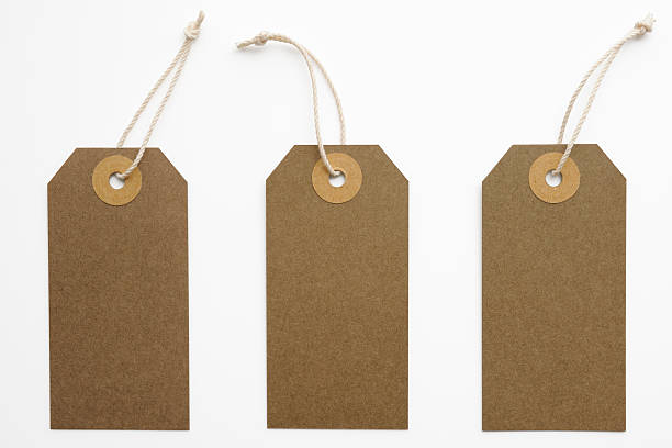 Three blank brown paper tags isolated on white background with clipping path.