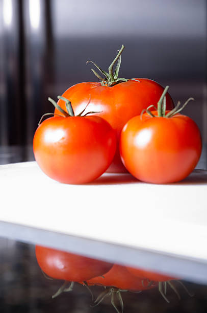 Three red tomatoes