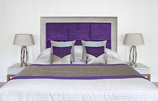 istock beautiful bed dressed in purple 185096877