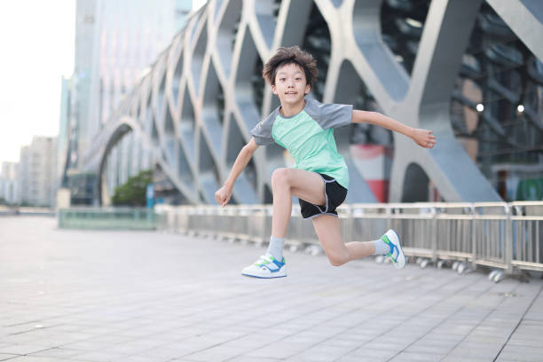 istock Boy Stretching In A Public Park 1850970409
