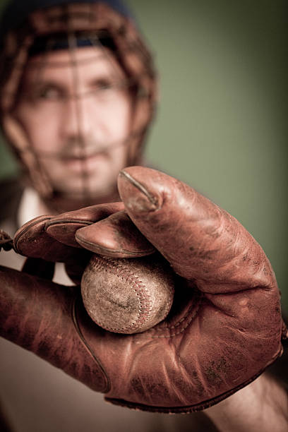 istock Vintage Baseball Player in Catching Stance with Ball and Mitt 185097223