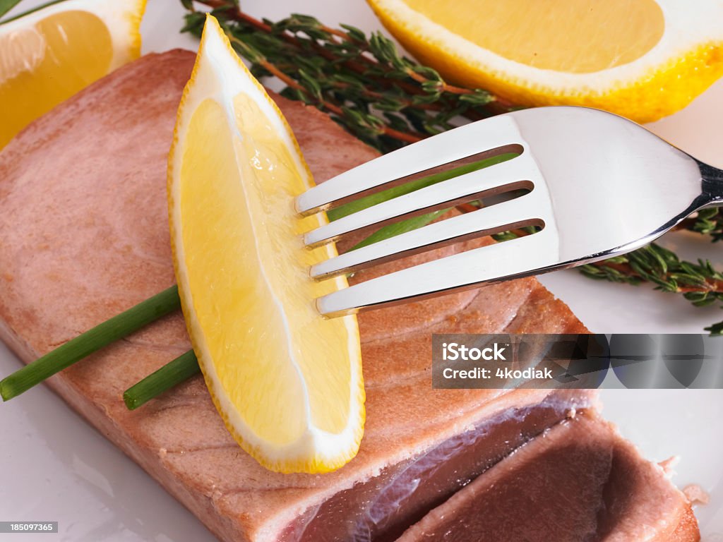 Tuna Steak and Lemon Lemon and Tuna Steak. Cod Liver Oil Stock Photo