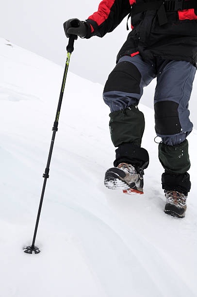 istock Mountain man climbing in winter season 185098200