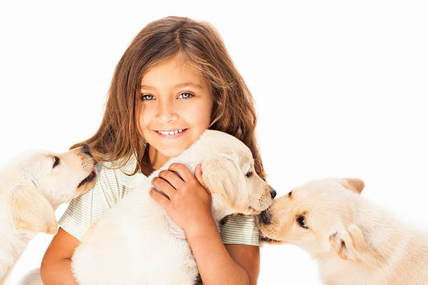 istock Little Girl Embracing Her Pets 185098644
