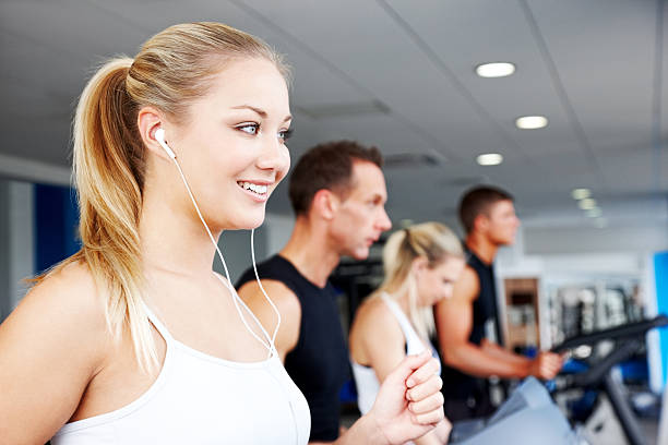 istock Group of gym people on cardio machines 185098686
