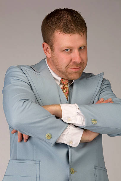 istock Nerdy businessman wearing a blue retro suit 185098695