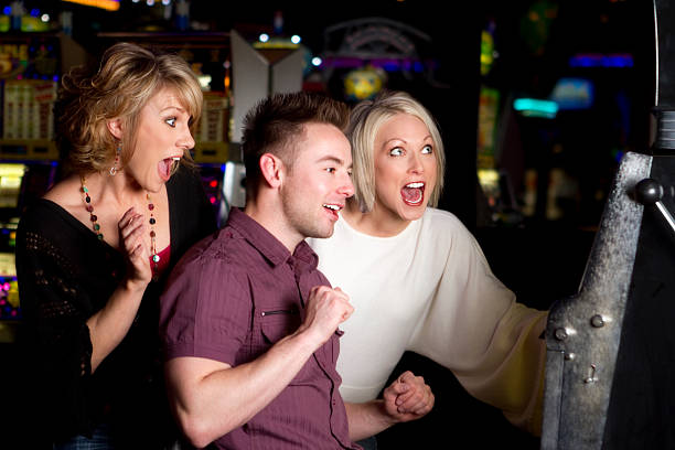istock Excited Trio at Slot Machine 185099056