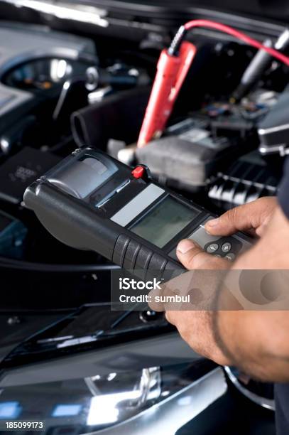 Auto Mechanic Checking Car Battery Stock Photo - Download Image Now - Car Battery, Electric Vehicle, Repairing