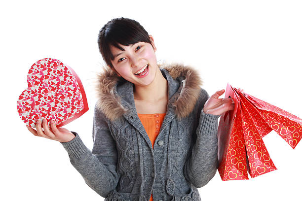 istock happy young woman shopping 185099265