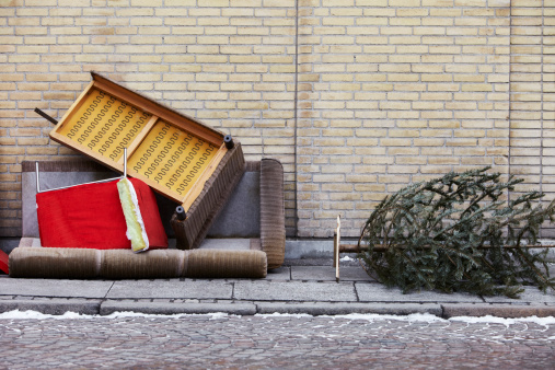 Furnitures and christmas tree thrown out on the street