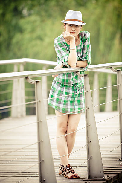 asian student standing on the bridge.adobe rgb 1998 use...........