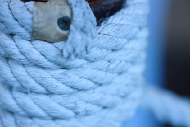 istock Wooden pole wrapped with white rope. 1851000683