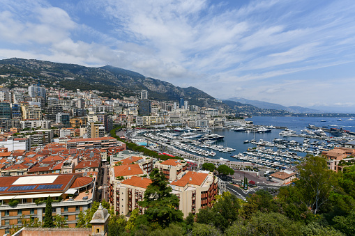 Monte-Carlo, Monaco Port Hercules and Monaco landscape view from port. Terrace du Palais Stephen Abragan Lifestyle city mood. Luxury lifestyle. Super Yachts. Apartments.