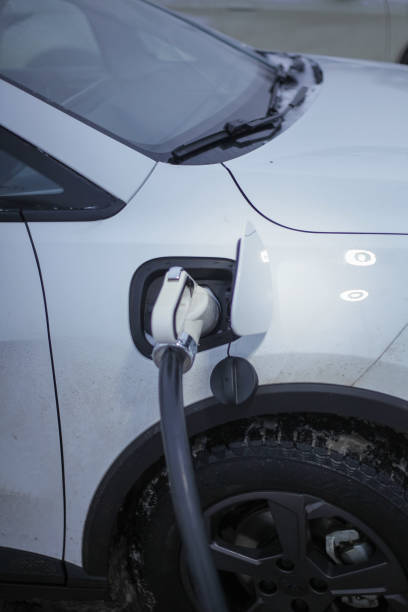 istock charging an electric car in the parking lot 1851001268
