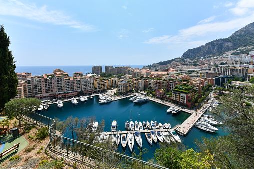 Yachts in bay near houses and hotels, Fontvielle, Monte-Carlo, Monaco, Cote d'Azur, French Riviera.