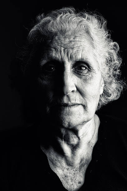 Portrait Serene portrait of an old woman with white hair high contrast stock pictures, royalty-free photos & images