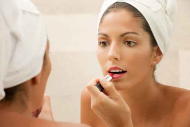 istock Natural Beauty putting on Make-Up, Lipstick (XXXL) 185101593
