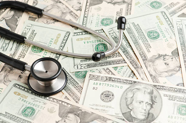istock medical stethoscope and dollar 185101868