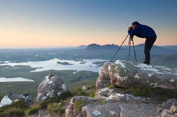 istock Photographer on mountain top at sunset 185102474