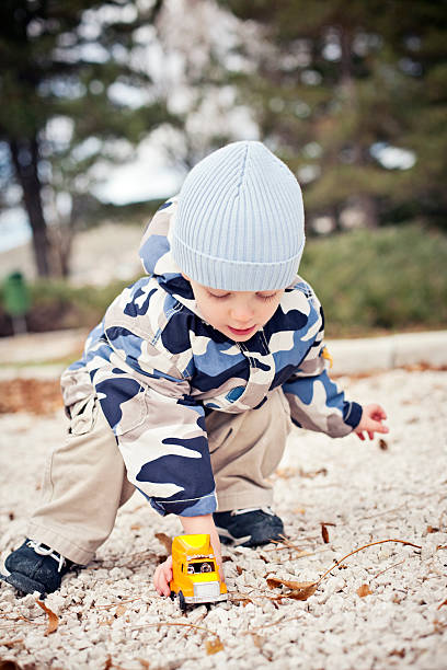 Toddler playing in the park stock photo