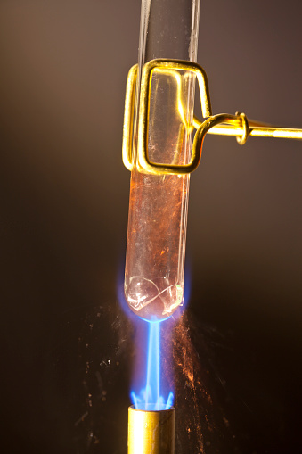 Bunsen burner heating a test tube. And then it breaks! Actual breaking. Not Photoshopped. Lucky shot. CLICK TO SEE MORE!