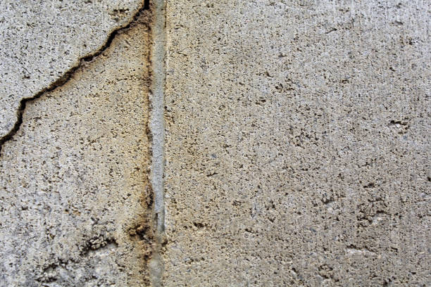 istock Close up textured background of a cracked concrete block 1851028199