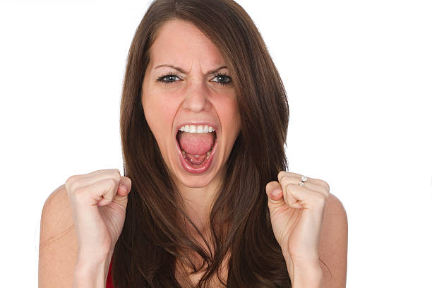 istock woman screaming and making fist 185104204